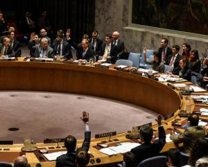 Members of the security council vote for a draft resolution condemning the reported use of chemical weapons in Syria. Photo: Reuters