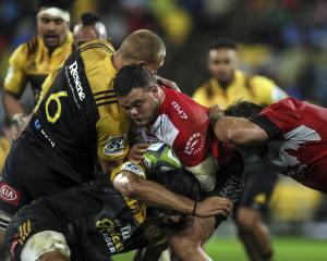 Dylan Smith of the Lions is tackled. Photo: Getty