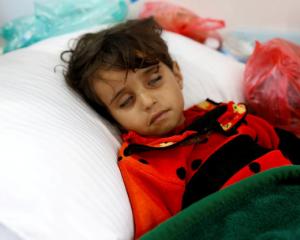 Girl infected with cholera lies on the ground at a hospital in Yemeni capital Sanaa. Photo: Reuters