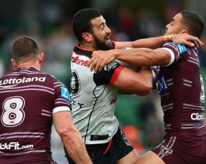 Ben Matulino of the Warriors gets tackled by Dylan Walker of the Sea Eagles. Photo: Getty