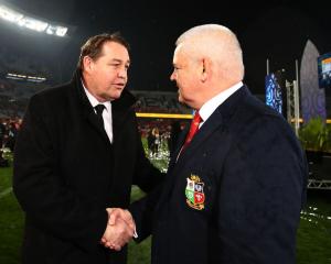 All Black coach Steve Hansen (L) shakes hands with Lions coach Warren Gatland after the match....