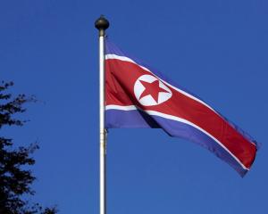 A North Korean flag flies on a mast at the Permanent Mission of North Korea in Geneva,...