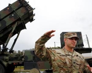 US captain Thomas Harris gestures during the joint Nato exercise 'Aurora 17' at Save airfield in...