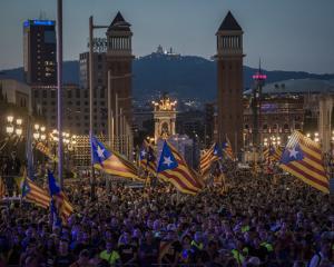 Crowds in Barcelona wave Catalan flags in preparation for the upcoming independence vote. Photo...