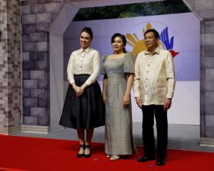 Jacinda Ardern poses with Philippines President Rodrigo Duterte and Honeylet Avancena as she...