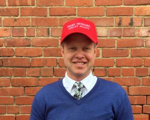 Great stuff ... Campbell and Sons managing director Clark Campbell models a cap promoting the...