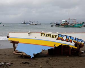 The remains of a passenger boat capsized during a typhoon last month. Photo: Reuters
