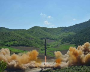 The intercontinental ballistic missile Hwasong-14 is seen during its test launch. Photo: Reuters