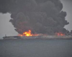 Smoke and fire is seen from Panama-registered tanker Sanchi carrying Iranian oil after it...