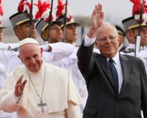 Pope Francis and Peru's President Kuczynski wave, in Lima. Photo: Reuters