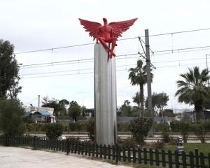 A red angel-shaped statue called 'Phylax' by Greek artist Kostis Georgiou is seen in southern...