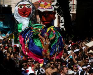 Revellers take part in the annual block party known as "Carmelitas", during carnival festivities...