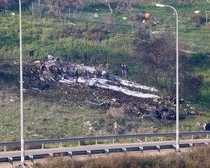 The remains of an F-16 Israeli war plane can be seen near the Israeli village of Harduf. Photo:...