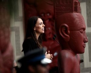 New Zealand Prime Minister Jacinda Ardern speaks on the veranda of Te Whare Runanga on the...