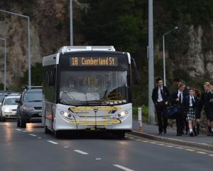 Motorists wait as a bus unloads Bayfield High School pupils on the Andersons Bay causeway last...