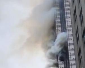 Smoke rises up from Trump Tower in New York. Photo: Reuters/ Twitter@brightbazaar