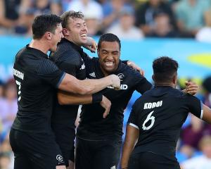 New Zealand celebrate winning the Men's Gold Medal Rugby Sevens Match between Fiji and New...
