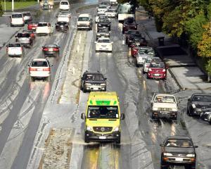 An ambulance crawls through the slush on Stuart St. A short but sharp hailstorm yesterday...