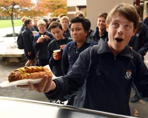 King's High School pupil Zac Bell (14) gets his well-earned lunch at the school canteen. PHOTO:...