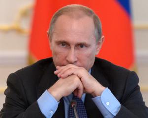 Russian President Vladimir Putin chairs a government meeting at the Novo-Ogaryovo state residence...