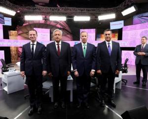 Presidential candidates pose for a group photo during their third and final debate in Merida....