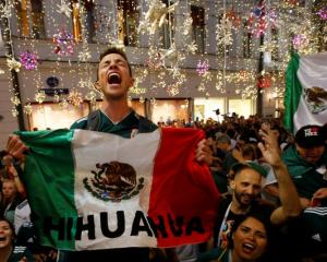 Mexico's fans celebrate victory of their team after the match. Photo: Reuters