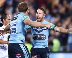 Jake Trbojevic and James Maloney of the Blues celebrate victory after game two of the State of...