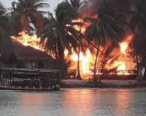 The Aitutaki Lagoon Resort &amp; Spa up in flames. Photo: Annita Cyprien Drollet via NZ Herald