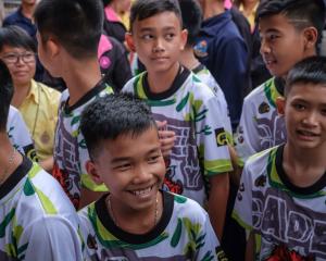 The 'Wild Boars' soccer team arrive for a press conference for the first time since they were...