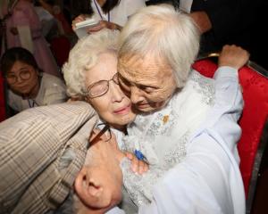 North and South Korean family members meet during a reunion at North Korea's Mount Kumgang resort...