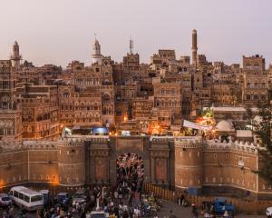 The Yemen gate and the old city of Sana'a at night. Photo: Getty Images