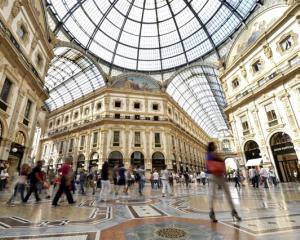 People walk along the Galleria Vittorio Emanuele II shopping mall in Milan. Photo: Reuters