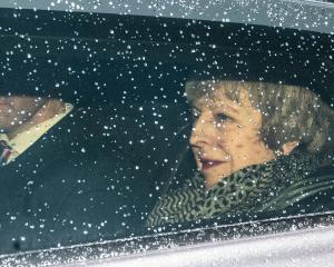 British Prime Minister Theresa May leaves Downing Street to face a vote of no confidence in the...