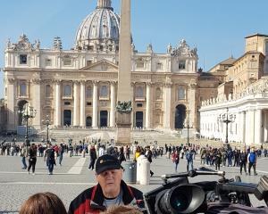 Darryl Smith being interviewed by Australian media in St Peter's Square yesterday, after being...