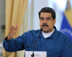 Nicolas Maduro retains the backing of Russia and China and control of Venezuelan state...