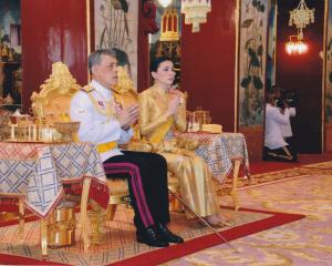 Thailand's King Maha Vajiralongkorn and Queen Suthida attend a religious ceremony for the...