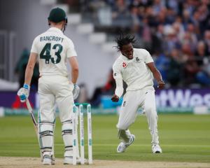 England's Jofra Archer celebrates taking the wicket of Australia's Cameron Bancroft. Photo:...