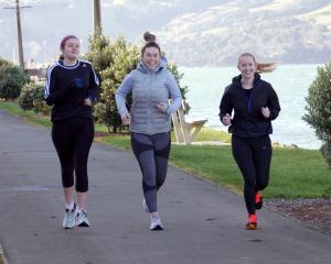 Friends (from left) Briar Waugh, Georgia Pringle and Ruby Pringle run along the cycleway-walkway...