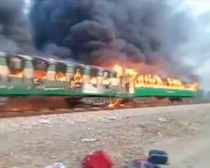 Video grab of a fire burning in a train carriage after a gas canister passengers were using to...