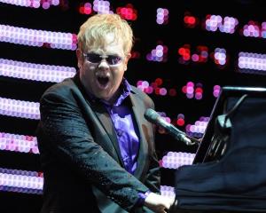 Sir Elton John belts out a hit in Dunedin's Forsyth Barr Stadium last night. Photo by Craig Baxter.