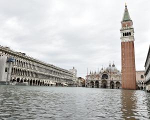 A general view of the flooded St. Mark's Square, as high tide reaches peak, in Venice, Italy....