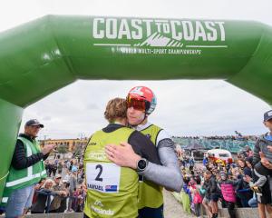 Dougal Allen (right) congratulates winner Sam Clark at the finish line. Photo: Getty Images 