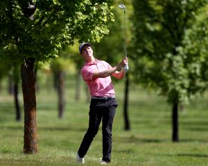 Leading New Zealander Harry Bateman plays an approach shot at Millbrook during the first round of...