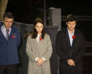 Prime Minister Jacinda Ardern stands at dawn on the driveway of Premier House with her father...