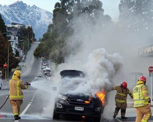 A couple from Mosgiel managed to get out of their car before it burst into flames in Stanley St,...