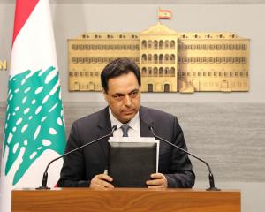 Lebanon's Prime Minister Hassan Diab speaks during a televised address to the the nation at the...