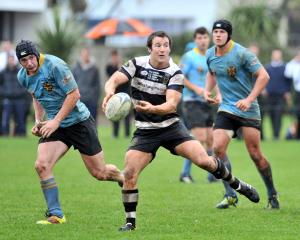 University flanker Dale Jarden (left) shadows Southern halfback Robbie Smith during a Dunedin...
