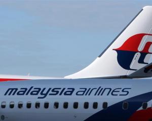 The Malaysian Airline System Bhd. (MAS) logo is displayed on the company's aircraft at Kuala...
