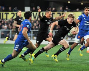 Arron Smith celebrates as Damian McKenzie scores a try against France in Dunedin in 2018. Photo:...