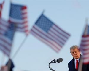 US President Donald Trump speaks at Joint Base Andrews in Maryland after leaving the White House....